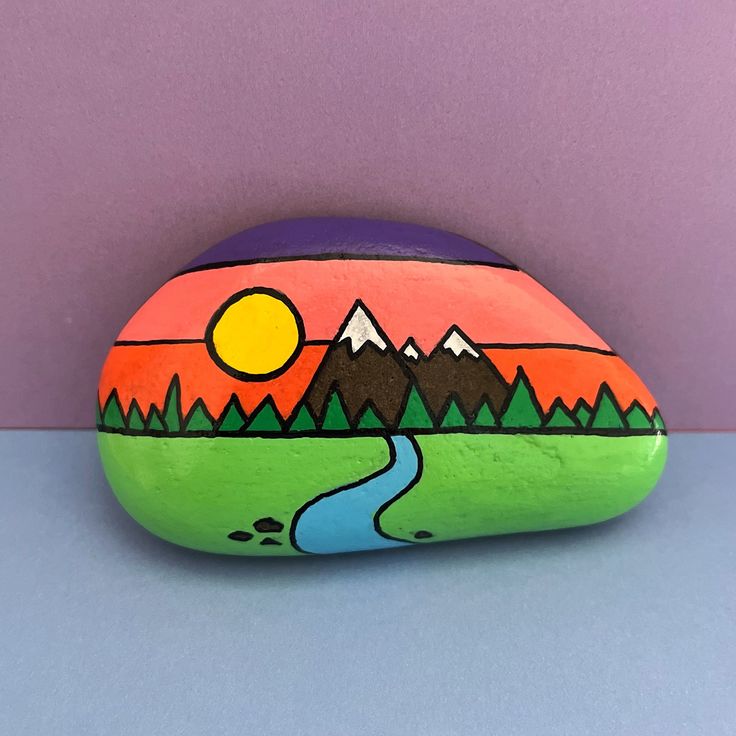 1 of 1! 🤩 Hand painted acrylic rock painting, on natural beach pebble! ⛰️🏔️ Sealed with varnish 🎨 Hand signed on back ✍️ (Colours may vary slightly) Beach Rock Art Ocean, Smile Rock Painting, Painting Mountains On Rocks, Rectangle Rock Painting Ideas, Scenery Rock Painting, Art Rocks Painting, Nature Rock Painting Ideas, Nature Rock Painting, Painted Rock Ideas For Kids