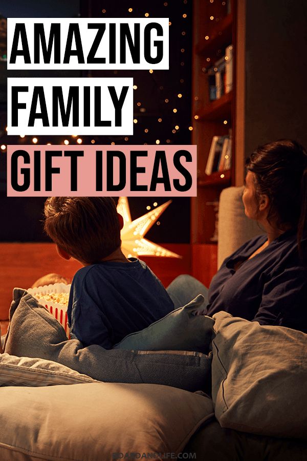 two people sitting on a couch watching tv with the words amazing family gift ideas above them