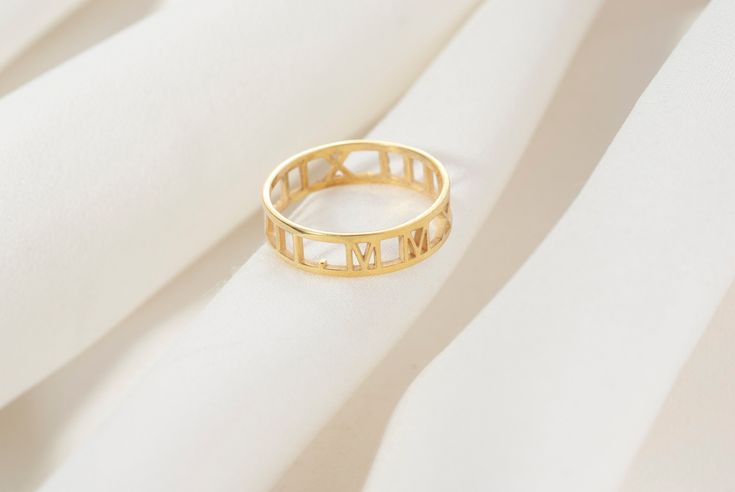 "This dainty and elegant Personalized Roman Alphabet Stackable Ring would make the perfect family birthday gift or a treat for you! PRODUCT DETAILS The material is Solid 925 Sterling Silver. Gold and rose are plated over solid 925 sterling silver. ❤ The Ring comes in a special gift box HOW TO ORDER  1- Choose your Ring color and Ring size from the drop-down menu. Available colors are silver rose gold and gold 2- Press add to cart and write your letters, numbers, symbols, into the ''PERSONALIZATI Engagement Ring Minimal, Roman Alphabet, Roman Letters, Roman Numeral Ring, Numbers Symbols, Ring Minimal, Bridesmaid Rings, Family Birthday, Perfect Family