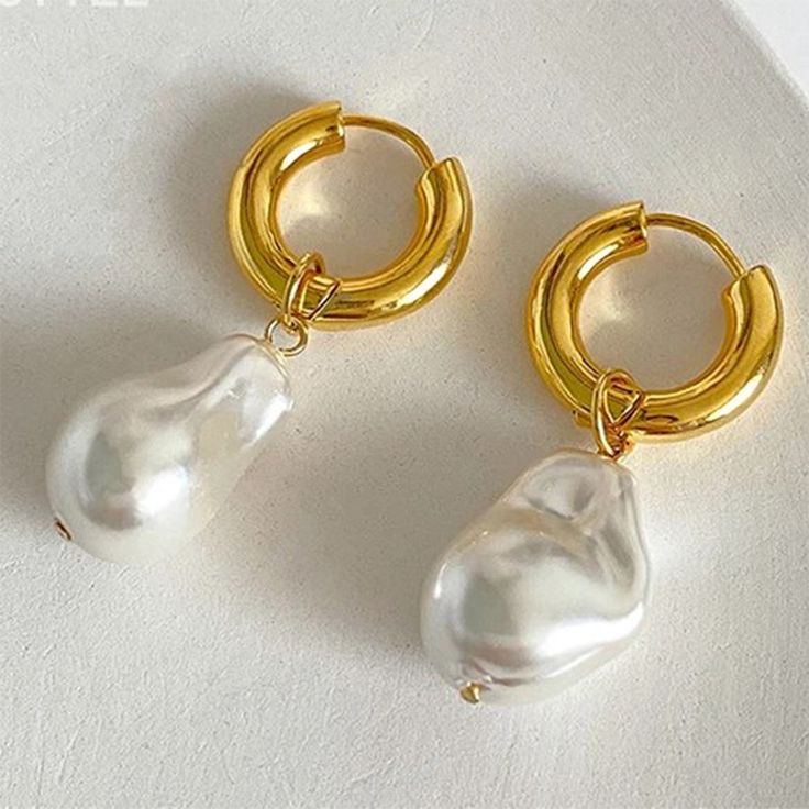 Large but Light Pearl Earrings! These beautiful pearl earrings feature a unique design with the perfect combination of dangle and drop. Perfect for weddings, birthday gifts, work, a special day out, or everyday wear.These earrings are perfect for all day wear. They're lightweight and add a touch of elegance to any outfit. Whether you're dressing up for a wedding or just running errands, these pearl earrings will make you feel elegant.You can wear them as hoop earrings or unique pearl dangle earr Trendy Clip-on Drop Earrings For Wedding, Trendy White Pearl Drop Earrings, Trendy White Drop Pearl Earrings, Trendy Hypoallergenic Wedding Earrings, Trendy Hypoallergenic Earrings For Wedding, Single Teardrop Metal Pearl Earring, Metal Hoop Earrings With Pearl Charm For Gift, Metal Hoop Earrings With Pearl Charm As A Gift, Pearl White Drop Clip-on Earrings For Gift