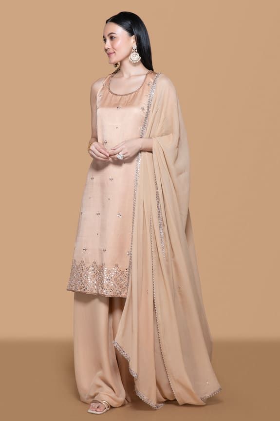 Fawn kurta with all over floral butti pattern, contrast thread, mirror, bead, zari and stone embroidery. Paired with flared palazzo and embroidered dupatta. - Aza Fashions Elegant Summer Unstitched Suit With Straight Kurta, Elegant Art Silk Unstitched Suit, Festive Silk Unstitched Suit, Elegant Summer Salwar Kameez In Chanderi, Elegant Mirror Work Salwar Kameez For Summer, Elegant Summer Chanderi Salwar Kameez, Elegant Summer Salwar Kameez With Mirror Work, Sheer Dupatta Unstitched Suit For Reception, Fitted Cotton Silk Palazzo Set For Wedding