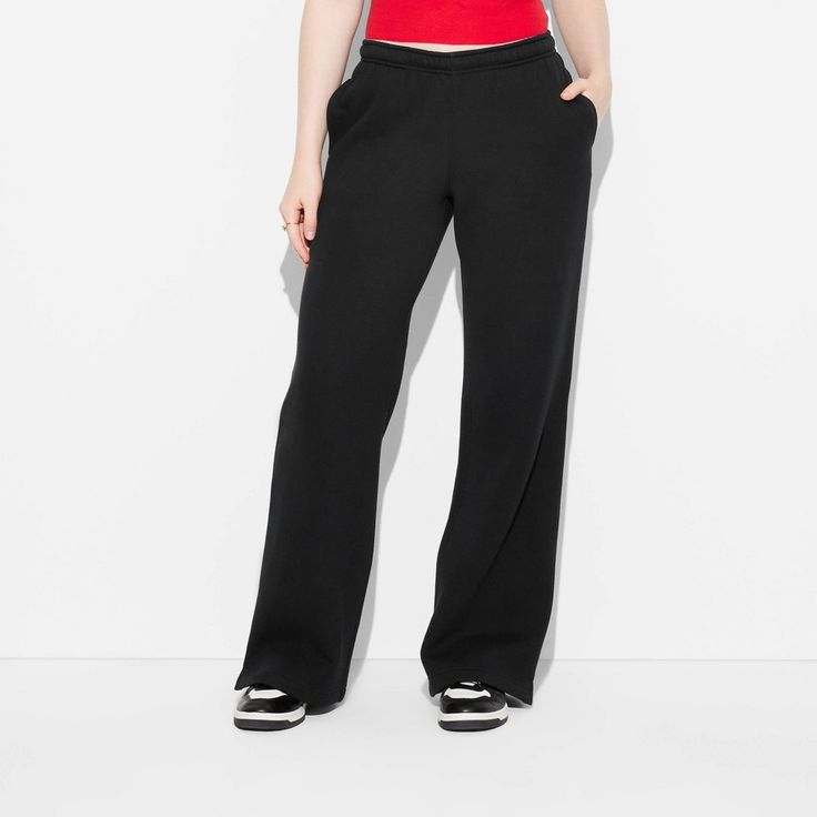 Solid-color fleece sweatpants from Wild Fable™. Made from a midweight cotton-recycled polyester blend. Sport an elasticized waistband with a drawstring for a customizable fit. Tailored in wide-leg, straight-fit silhouette and side vents. Functional side pockets complete the look and provide space for your on-the-go essentials. Wild Fable™: A look for every story. If you're not satisfied with any Target Owned Brand item, return it within one year with a receipt for an exchange or a refund. Basic Jogging Pants With Ribbed Waistband, Basic Stretch Sweatpants With Ribbed Waistband, Basic Sports Pants With Ribbed Waistband, Casual Activewear With Elastic Waistband, Casual Activewear With Elastic Waistband And Straight Hem, Athleisure Straight Joggers With Ribbed Waistband, Sporty Fall Sweatpants With Elastic Waistband, Comfort Stretch Sweatpants With Ribbed Waistband, Sporty Solid Color Sweatpants