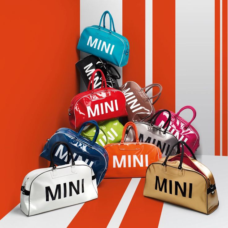 mini purses are stacked on top of each other with the word'mini'printed on them