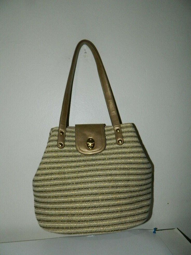 UNBRANDED WEAVING STRIPES SHOULDER HANDBAG. NEW WITHOUT TAG.  SHIPPED WITH USPS PRIORITY  MAIL (2-3 BUSINESS DAY). BEAUTIFUL TOTE WITH GOLD TONE HARDWARE AND HANDLES, WITH AN INTERIOR THAT HAS A BEIGE LINING, ONE WALL ZIPPERED COMPARTMENT AND TWO SLIP OPEN POCKETS. TURN LOCK CLOSURE, CAN BE A GREAT SUMMER PIECE IN YOUR CLOSET. MEASUREMENTS ARE APPROX.: 14"W X 10"H X 6"D x 9.5SD. BAG IS IN EXCELLENT CONDITION.   PLEASE LOOK AT ALL THE PICTURES, IF YOU NEED MORE INFORMATION DO NOT HESITATE TO CONT Everyday Striped Straw Bag, Woven Striped Bags, Striped Woven Rectangular Shoulder Bag, Rectangular Striped Woven Shoulder Bag, Striped Shoulder Bag With Braided Handles, Striped Woven Tote Bag, Woven Striped Shopping Bags, Striped Woven Bags For Shopping, Striped Woven Shopping Bags