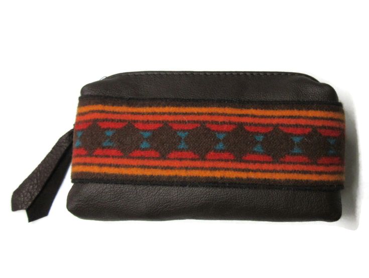 "This leather pouch measures about 7\" x 4\". Gussets added so the pouch will sit flat. Perfect to carry cosmetics. Cosmetics NOT included. Perhaps you would like to use this as a small clutch purse. Maybe use it in your larger bag to keep all those small things organized. I made the applique from Pendleton Blanket Wool for the front. No lining to get dirty. Leather gets better with age. This bag will last a lifetime. To go back to my homepage click here: https://timberlineltd.etsy.com" Rectangular Brown Cosmetic Bag, Everyday Brown Rectangular Cosmetic Bag, Brown Pouch With Cell Phone Pocket As Gift, Brown Rectangular Coin Purse For Travel, Brown Pouch Cosmetic Bag Gift, Brown Pouch Cosmetic Bag For Gift, Brown Pouch Cosmetic Bag, Gift Brown Pouch With Cell Phone Pocket, Brown Cosmetic Bag With Removable Pouch For Personal Use