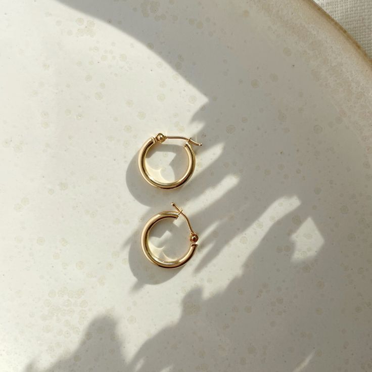 If you're the type of person who relies on staples for everyday wear, snag these classic hoops that will last, wear after wear. An elevated version of our gold fill hoops with an endless snap closure. Sold as a pair. Each purchase comes with an elegant, vegan leather box for storing + caring for your jewelry. DETAILS14k Solid Gold | 15mm hoops Minimalist Recycled Gold Huggie Earrings, Everyday Recycled Gold Huggie Earrings, Everyday Round Huggie Earrings In Recycled Gold, Simple Yellow Gold Tarnish Resistant Huggie Earrings, Simple Yellow Gold Tarnish-resistant Huggie Earrings, Classic Huggie Earrings In Recycled Gold, Nickel-free 14k Gold Classic Huggie Earrings, Classic 14k Gold Nickel-free Huggie Earrings, Classic Nickel-free 14k Gold Huggie Earrings