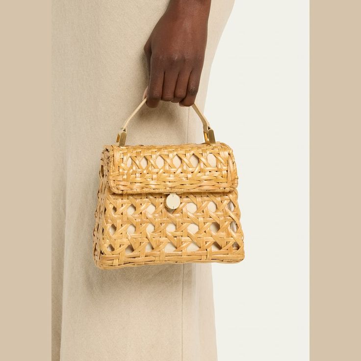 Cult Gaia "Sybil" crossbody bag in cutout rattan and leather  Flat top handle  Detachable crossbody strap Can be worn as a top handle or crossbody bag  Flap top with magnetic closure  Approx. 3.5"H x 7.9"W x 0.1"D Spot clean Imported Cult Gaia, Flats Top, Leather Flats, Crossbody Strap, Magnetic Closure, Top Handle, Crossbody Bag, Tops Designs, Gift Ideas