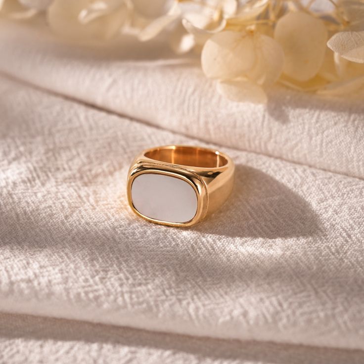 The Golden Mother of Pearl Ring exudes luxury and elegance with its unique combination of mother of pearl and gold. Each golden mother-of-pearl is carefully selected and finished to give a gem-like lustre and layered look. The yellow gold surround adds to the splendour of the ring, showcasing a regal aura. Whether paired with everyday décor or special occasions, the gold mother-of-pearl ring offers a uniquely stylish and sophisticated wearing experience. ♥Thank you for choosing us, all of our pi Classic White Pearl Open Ring, Minimalist White Ring For Formal Occasions, Minimalist White Rings For Formal Occasions, White Minimalist Rings For Formal Occasions, Gold Minimalist Pearl Ring, Minimalist Gold Pearl Ring With Detail, Elegant White Enamel Wedding Ring, Elegant White Pearl Ring Gold Plated, Elegant White Enamel Ring For Gift