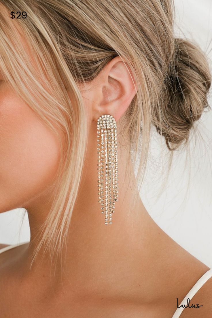 The Petit Moments Glitz Gold Rhinestone Tassel Earrings are just the kind of look that we wanna wear out (and get noticed in)! Elegant strands of shiny gold snake chain and clear rhinestone chains cascade from post backs. Pair with your favorite LBD and you'll easily make it a night to remember! Post backs. 3. 25" Long. 40% Zinc Alloy, 60% Glass. Imported. Lulus | Glitz Gold Rhinestone Tassel Earrings. Rhinestone Tassel Earrings, Gold Rhinestone Earrings, Gold Snake Chain, Prom Earrings, A Night To Remember, Prom Jewelry, Gold Statement Earrings, Tassel Drop Earrings, Sparkly Earrings