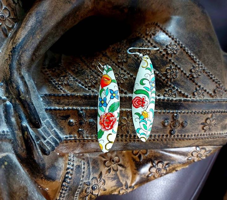 "These are early 1970's Vintage Tin Earrings.  The design and colours are really bright.   They measure approximately 2\" in length and are shaped so are not completely flat. Images and therefore colour of different flowers may differ due to the cut /pattern of the tin. Please note these have been restored from vintage tin so there may be imperfections which is part of the history of the item and in my opinion adds to the character. . The Tin is attached to Sterling Silver Ear Wires.  PackagingA Handmade Retro Silver Earrings, Hand Painted Multicolor Sterling Silver Earrings, Vintage Hand Painted White Earrings, Vintage White Hand Painted Earrings, Van Gogh Jewelry, Tin Earrings, Statement Chandeliers, Silver Gift Box, Gifts For Art Lovers