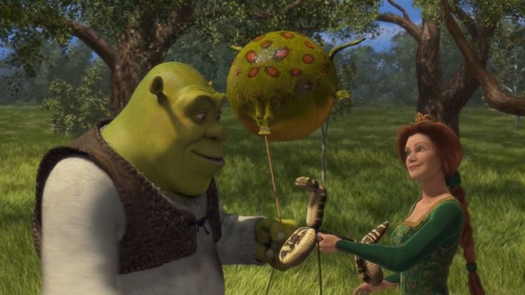 an animated character is handing something to a woman in a green dress and headband