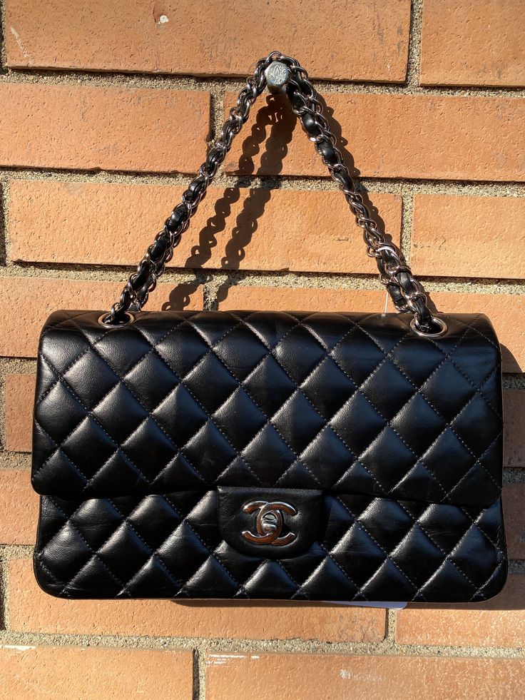 The most desired handbag from Chanel! This is a Chanel Classic flap bag in medium size, black lambskin leather and silver plated hardware in good condition. The bag was prepared for sale in a professional leather spa. The handbag has been tinted partially, we took this into account in this special price. Comes with a dustbag. No card. Hologram 13xxxxxx. Measurements: 25 x 15 x 7 cm Formal Soft Leather Bag With Double Flap, Elegant Double Flap Soft Leather Bag, Classic Bags With Double Flap And Silver-tone Hardware, Classic Bags With Palladium Hardware And Double Flap, Classic Bag With Palladium Hardware And Double Flap, Classic Shoulder Bag With Silver-tone Hardware And Double Flap, Luxury Bag With Silver-tone Hardware And Double Flap, Luxury Bags With Silver-tone Hardware And Double Flap, Luxury Double Flap Bag With Silver-tone Hardware