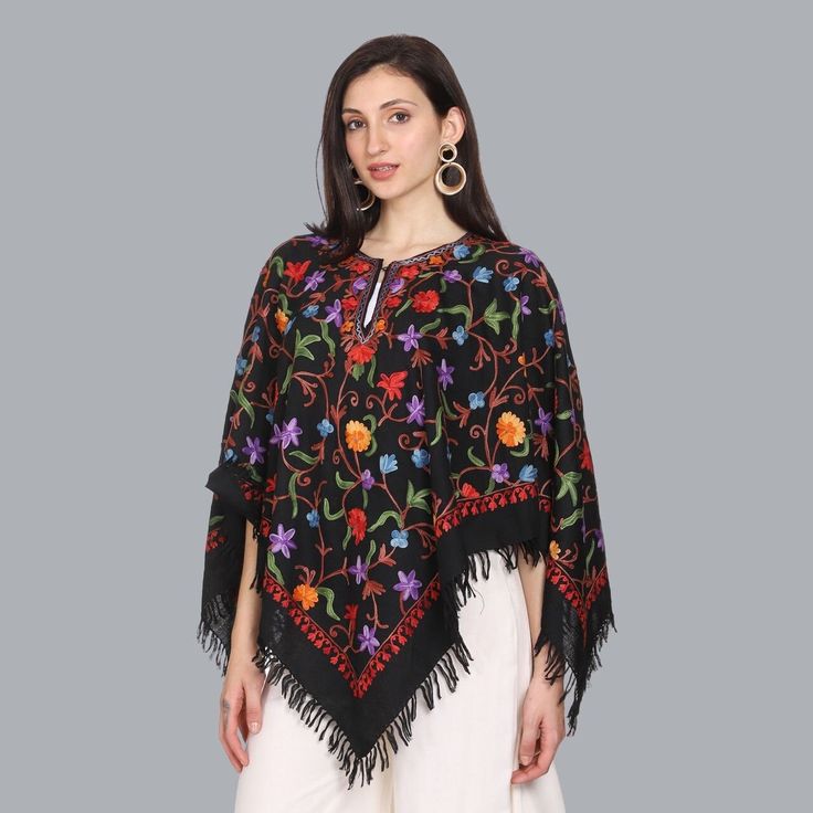 Stunning Kashmiri Embroidered Handcrafted Woolen Black Multi Color Poncho Free Size Original Product of Kashmir Traditional Black Cape For Fall, Traditional Black Shawl Outerwear, Traditional Black Festival Cape, Traditional Black Cape For Festival, Winter Festival Embroidered Poncho, Festival Black Embroidered Poncho, Folk Style Black Shawl For Winter, Winter Embroidered Long Sleeve Poncho, Traditional Black Shawl With Floral Embroidery