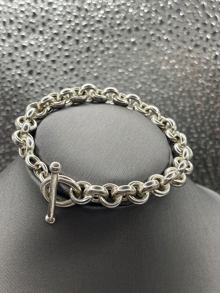 A classic design ladies Sterling Silver bracelet designed in round Cuban links.   Weight:  18.2 grams Length:  7" Our Price $189.00 Regularly Priced At $360.00 Please See Our Video Remember - If you're purchasing for yourself or a gift for a loved one, buy with confidence.  We Guarantee Everything We Sell!  SKU #B808 Cheap Nickel-free Sterling Silver Round Bracelet, Luxury Elegant Sterling Silver Bracelet With Clasp, Classic Metal Bracelet With Oval Link, Classic Metal Bracelets With Oval Link, Classic Polished Chain Link Bracelets, Classic Jubilee Bracelet With Oval Links, Classic Bangle Charm Bracelet For Formal Occasions, Classic Metal Bracelets With Sterling Silver Clasp, Classic Charm Bracelet With Sterling Silver Clasp