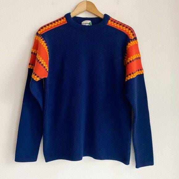 Embrace the retro vibe with this Vintage Aspen Skiwear pullover sweater. The navy blue and orange geometric print adds a pop of color to any outfit. Made for men in size M, this sweater features a classic pullover style that never goes out of fashion.   Crafted from high-quality materials, this sweater is perfect for any occasion. Whether you're hitting the slopes or simply going out for a night on the town, this vintage sweater will keep you looking stylish and comfortable.  Don't miss your chance to add this unique piece to your wardrobe today. No Size tag but looks to be approx a medium Chest: 46" 100% Acrylic Made in Hong Kong Orange And Blue Sweater, Orange And Blue Clothes, Retro Orange Long Sleeve Sweater, Retro Blue Long Sleeve Sweater, Orange Retro Long Sleeve Sweater, Orange Long Sleeve Retro Sweater, Blue Long Sleeve Retro Sweater, Retro Blue Tops For Fall, Blue Retro Fall Tops