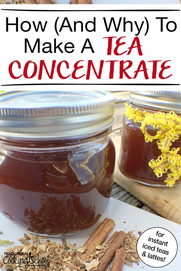 two jars filled with tea and cinnamon on top of a cutting board