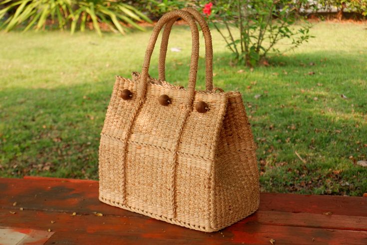 This Tote classic is handwoven in thailand from waterhyacinth and ideal for carrying groceries,and other daily essentials. Measures approximately (DxLxH) 20 x 35 x 30 cm drop length 6.5 inches Cream lining Detail made from ; water hyacinth    HOW TO CARE  1. Avoid humidity and expose them to the sun often. 2. Spot clean with damp cloth SHIPPING: # Processtimes 3-5 days # We will be SHIPPED via THAI AIRMAIL and had TRACKING No. # and Delivery Time 1-5 week We do offer WHOLESALE prices, large quan Eco-friendly Natural Rattan Bag, Handwoven Rectangular Rattan Bag, Eco-friendly Rectangular Rattan Beach Bag, Rectangular Bags With Bamboo Handle And Natural Fiber, Eco-friendly Handwoven Rattan Bag, Eco-friendly Rectangular Rattan Bag, Rectangular Natural Fiber Bag With Bamboo Handle, Eco-friendly Handwoven Rectangular Straw Bag, Eco-friendly Rectangular Handwoven Straw Bag