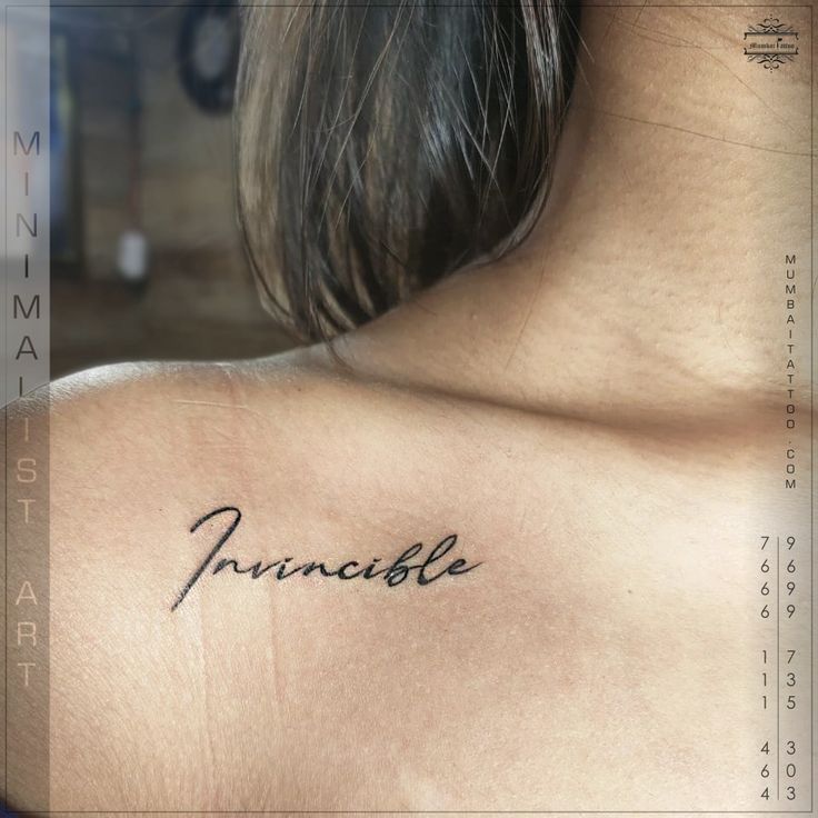 the back of a woman's shoulder with an inscription on it that reads pinnacle