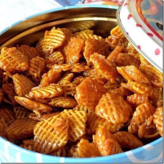 a bowl filled with cheetos covered in sauce and sitting on top of a table