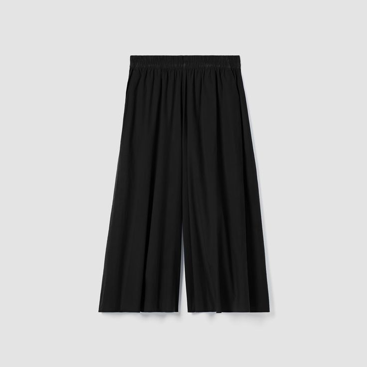 The skirt pant—a standout shape with an exaggerated wide leg. Drapes effortlessly in a poplin weave made from soft organic cotton. Spring Wide Leg Culottes With Elastic Waistband, Summer Stretch Wide-leg Culottes, Spring Stretch Culottes With Elastic Waistband, Spring Wide Leg Pleated Culottes, Spring Pleated Wide Leg Culottes, Spring Wide-leg Culottes With Elastic Waistband, Daywear Bottoms, Pleated Skirt With Relaxed Fit, Spring Workwear Bottoms With Wide Hem, Relaxed Fit Pleated Skirt For Daywear