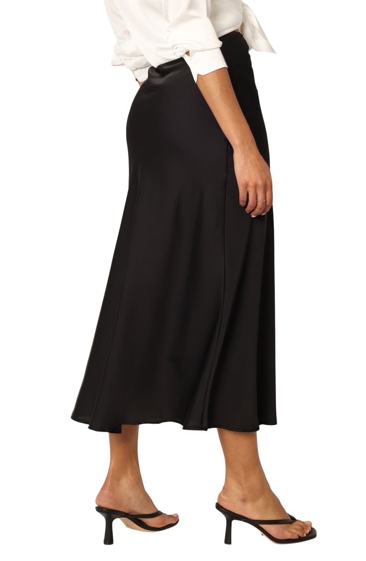 Smooth satin adds to the elegance of a beautifully draped skirt designed for a perfect fit with an elastic waist. Elastic waist 97% polyester, 3% spandex Hand wash, dry flat Imported Elegant Ruched Skirt In Solid Color, Flared Skirt With Elastic Waistband For Night Out, Elegant Ruched Solid Color Skirt, Elegant Solid Ruched Skirt, Chic Solid Color Ruched Skirt, Spring Flared Skirt Bottoms In Elastane, Elegant Flared Skirt With Ruched Detail, Elegant Ruched Flared Skirt, Solid Ruched Midi Skirt