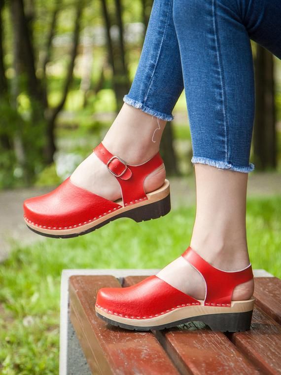 NEW CALF LEATHER CLOGS!!!!MADE FROM NATURAL CALF LEATHER AND NATURAL ALDER WOODCOLOR:  RED ✔ Handmade clogs with passion.✔ Natural Alder wood, calf leather.✔ Very light clogs✔ Soft, comfortable.✔ Hight quality, breathable.✔ Swedish design.✔ Eco-friendly packing.✔ Global express delivery!BENEFITS OF WOODEN CLOGS:➤ Wooden shoes such as Swedish clogs are helping in maintaining a straight posture.➤ Clogs are orthopedically designed to fit your feet perfectly➤ Sole Compression.➤ Better Strength and D Red Rubber Sole Mules For Summer, Casual Clogs With Red Sole And Round Toe, Spring Red Clogs With Wooden Heel, Summer Red Mules With Rubber Sole, Casual Red Clogs With Flat Heel, Red Leather Open Heel Clogs, Casual Red Closed Toe Clogs, Red Clogs With Wooden Heel For Summer, Red Summer Clogs With Wooden Heel