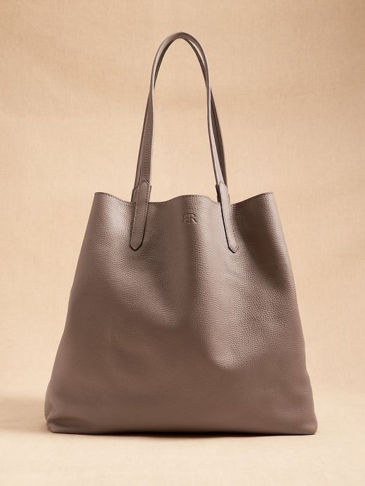 East-West Leather Tote | Banana Republic Everyday Leather-lined Laptop Tote Bag, Classic Tan Shoulder Bag For Everyday Use, Everyday Textured Leather Rectangular Laptop Bag, Classic Everyday Tote Laptop Bag, Classic Everyday Laptop Tote Bag, Luxury Everyday Tote Laptop Bag, Everyday Laptop Bag With Leather Lining And Tote Shape, Luxury Everyday Laptop Tote Bag, Everyday Laptop Bag With Leather Lining