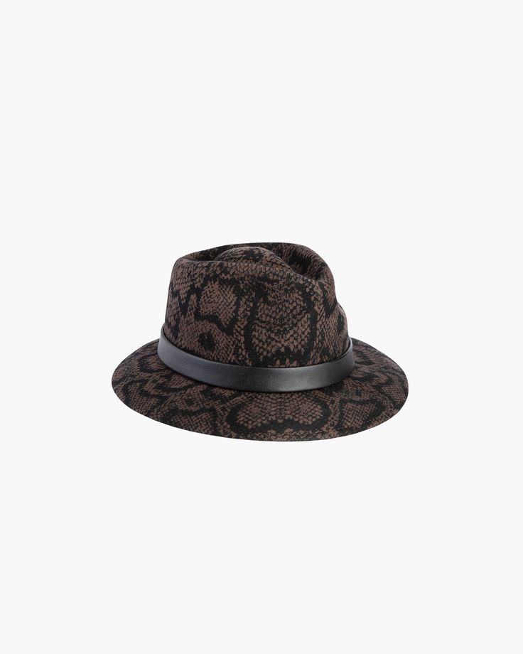 The versatile hand-blocked wool felt fedora banded with lamb leather is water-repellent. The Crown is fully lined. The elasticized inner band fits most. Packable. Made in the USA of imported materials. Sustainable wool is shorn and milled from multi-use sheep living on small farms under the most humane conditions. Designed and finished in USA Hand-blocked by skilled artisans Highest Quality Materials Sustainable wool Brim Span: 3"(7.6cm) Chloe 2024, Small Farms, Black Python, Art Costume, Band Fits, Wool Fedora, Felt Fedora, Women's Headwear, Wool Handmade