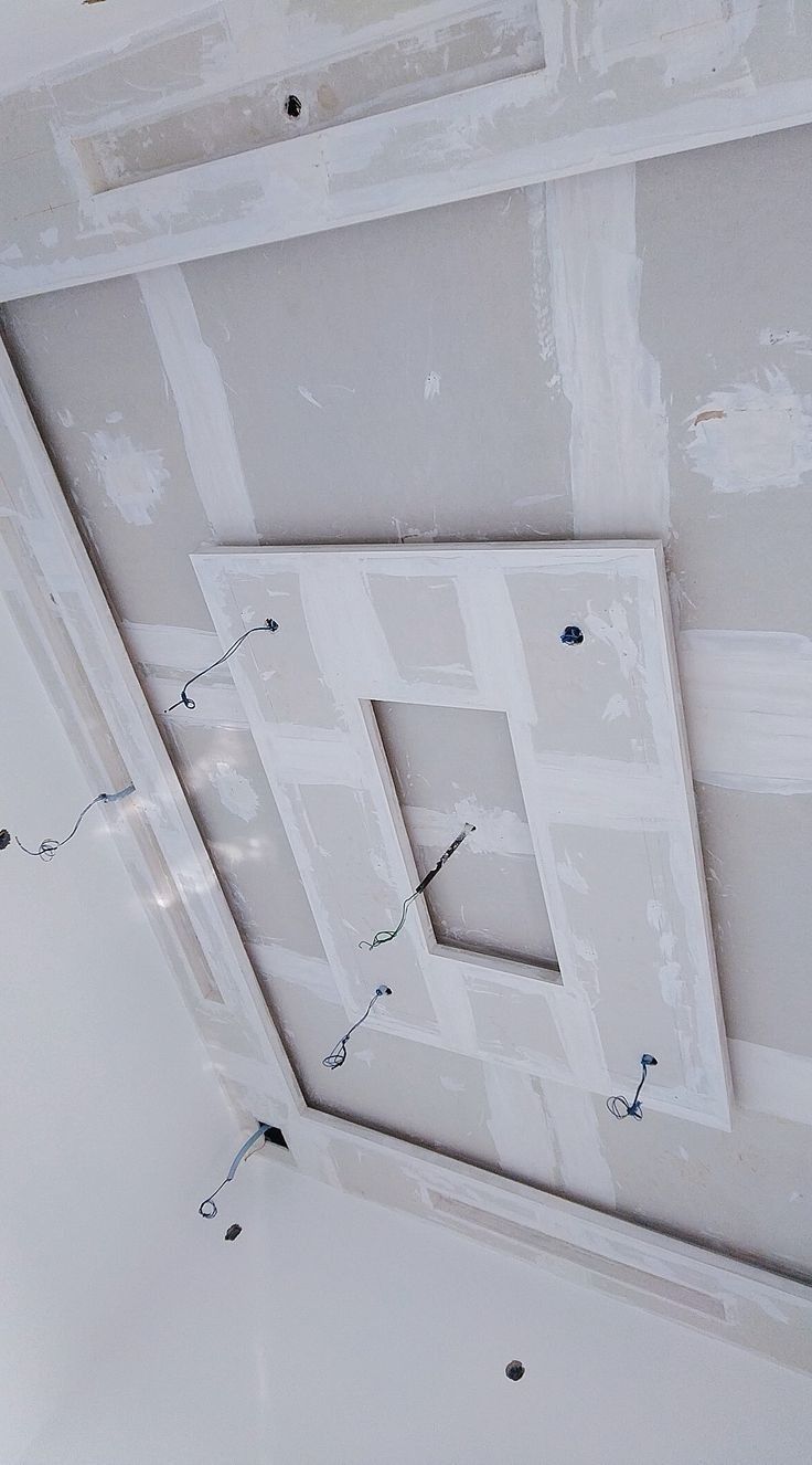 the ceiling is being painted with white paint