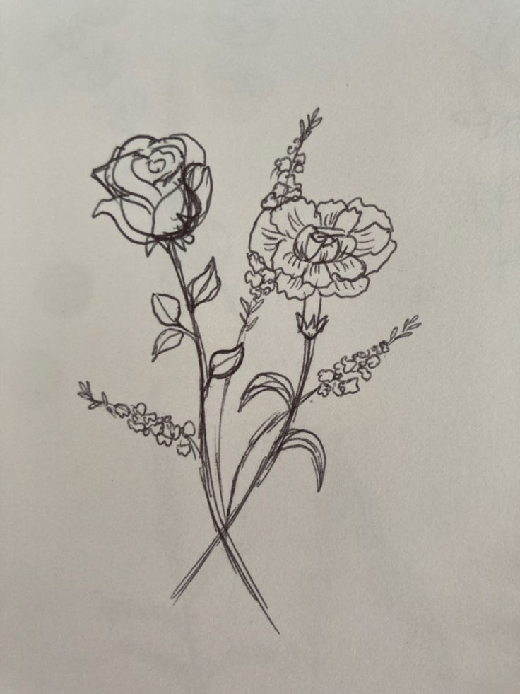 a drawing of three flowers on a white paper