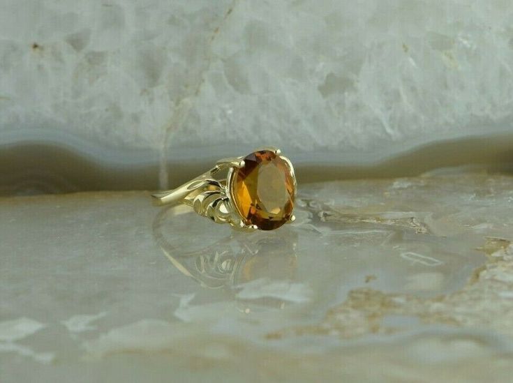 "10K Yellow Gold Citrine Ring, bypass design, 9x11 oval center stone deep honey color, Ring size 6, 3/8\" across, weight 3.25 grams Stock # BRT134R06 Most rings are sizable for a small fee. If the ring you are considering is the incorrect size contact us for a quote. This listing contains photographs of the actual item you will receive. Our items are in excellent condition with little or no signs of wear and many are one of a kind pre-owned estate finds. Please look closely at the pictures in th Classic Oval Brown Ring, Classic Brown Oval Ring, Classic Oval Citrine Rings, Oval Brown Jewelry For Anniversary, Brown Oval Jewelry For Anniversary, Classic Yellow Oval Topaz Ring, Brown Oval Gemstone Rings, Oval Amber Jewelry, Classic Oval Orange Topaz Ring