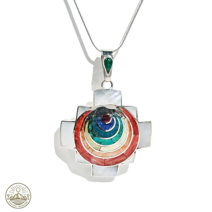 Elevate your style with our meticulously handcrafted 950 Silver Chakana Pendant, artfully embedded with an array of natural multicolored stones. This Chakana, a symbol rich in Andean heritage, becomes a wearable masterpiece, each piece a testament to skilled craftsmanship and timeless elegance. Product Features: Material: Forged from premium 950 silver, this Chakana pendant blends traditional significance with contemporary design, enhanced by the vibrant hues of natural stones. Handcrafted Excel Spiritual Multi-stone Round Jewelry, Fusion Multi-stone Round Necklace, Traditional Necklace With Gemstone Accents For Gift, Multicolor Stone Round Pendant Jewelry, Multicolor Round Pendant Jewelry With Stones, Traditional Multi-stone Gemstones For Gifts, Traditional Multi-stone Gemstones As Gift, Multicolor Multi-stone Round Jewelry, Multicolor Multi-stone Fusion Jewelry