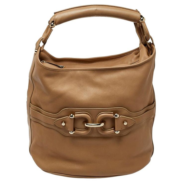 Burberry's equestrian sensibilities come alive in this hobo that is practical and stylish. Crafted from leather in a beige shade, it features a horsebit motif, a spacious interior, and a single handle. This bag can be carried for every day use. Versace Bags, Bottega Veneta Shoulder Bag, Hermes Bags, Vuitton Bag, Fendi Bags, Burberry Bag, Prada Bag, Dior Bag, Ysl Bag