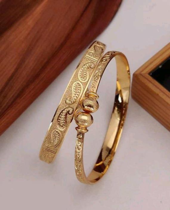 Material:- Brass, Gold Plated Pack- Bracelet These Beautiful Gold Platted Bracelet  Best for gifting and personal use, You can gift your Girlfriend, Mother, Sister , Relatives , Neighbours etc. Combine it with Matching Dress and be the Limelight of every Occasion ( Diwali, Birthday, Anniversary, Christmas, Any Ritual Festival). Suitable for all Occasions. a)These are very skin Friendly. b)The plating is Non- Allergic and safe for all Environment. Gift for Her, Best Friend Gift, Gift Ideas, Valen Adjustable Gold Bracelet With Intricate Design For Wedding, Adjustable Bangle Jewelry For Wedding, Adjustable Gold Wedding Bracelet With Intricate Design, Adjustable Intricate Design Gold Wedding Bracelet, Adjustable Wedding Bangle Jewelry, Adjustable Gold Bracelets For Wedding, Adjustable Gold Bangle For Wedding, Adjustable Gold Bangle With Intricate Design, Adjustable Silver Bracelet For Marriage