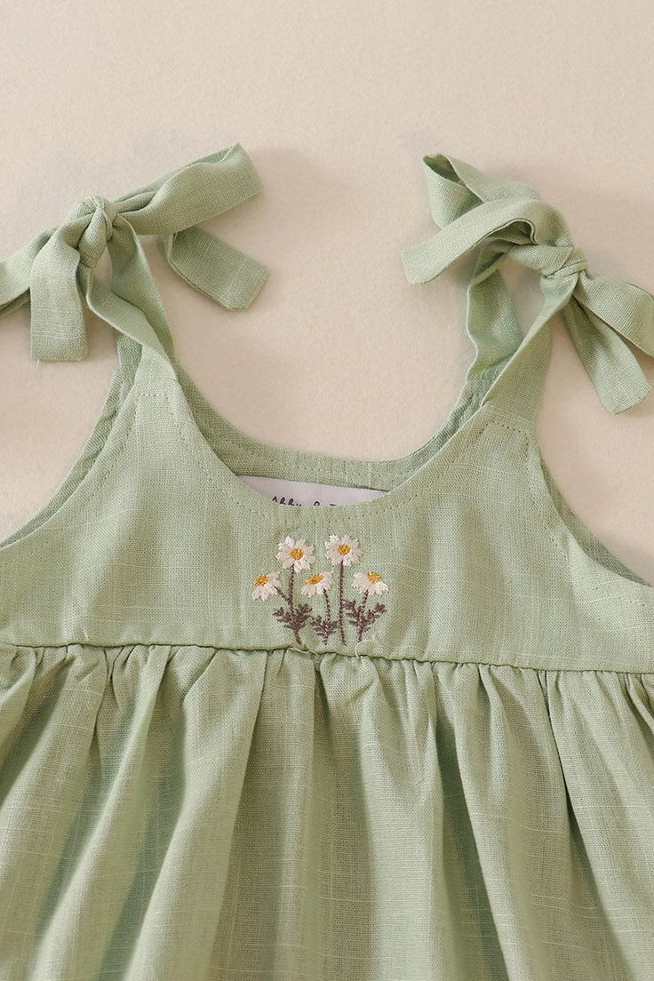 DESCRIPTION This flowy and fun Sage linen bubble dress features intricate floral embroidery and playful ruffle straps. Perfect for a sunny day out, this dress will be sure to turn heads with its unique and quirky style. FABRIC CONTENTS Linen PRODUCT CARE To launder this garment effectively while preserving its quality, follow these detailed washing and care instructions: Machine wash cold on gentle cycle. Wash similar colors together. Avoid using bleach products. Line dry in shade. Iron on a warm setting. Boring Outfits, Sequin Crafts, Quirky Style, Plaid And Leopard, Kid Fashion, Linen Clothing, Bubble Dress, Pet Holiday, Baby Boy Shoes