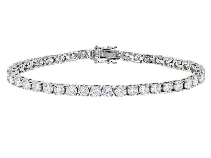 14.35ctw round Lab Created Strontium Titanate rhodium over sterling silver tennis bracelet. Measures approximately 7 & 1/4" L X 5/16" W and has a hidden box clasp. Classic Silver Tennis Bracelet With Channel Set, White Gold Channel Set Diamond Bracelet, White Gold Channel Set Tennis Bracelet For Anniversary, Silver Cubic Zirconia Channel-set Tennis Bracelet, Cubic Zirconia Channel Set Tennis Bracelet, Silver Cubic Zirconia Channel Set Tennis Bracelet, Channel Set Cubic Zirconia Tennis Bracelet, Silver Brilliant Cut Round Tennis Bracelet, Silver Brilliant Cut Tennis Bracelet