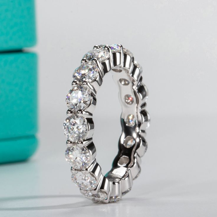 This eternity band ring is incredibly versatile and perfect for everyday wear, adding a touch of glamour to your outfit. It is also great for special occasions and can be stacked with other rings or paired with other pieces of jewelry to create a truly personalized look. Description Sterling Silver Moissanite Stones Round Stone Shape Clear Color 0.3ct (Each Stone) Weight About 3.5g GRA Certified Half Eternity Moissanite Band, Timeless Stackable Eternity Band With Cubic Zirconia, Diamond White Stackable Eternity Band In Fine Jewelry, Diamond White Stackable Eternity Band, Stackable Halo Cubic Zirconia Rings, Timeless Stackable Diamond White Eternity Band, Fine Jewelry Cubic Zirconia Eternity Band, Timeless Stackable Rings With Halo Detail, Cubic Zirconia Stackable Rings With Halo