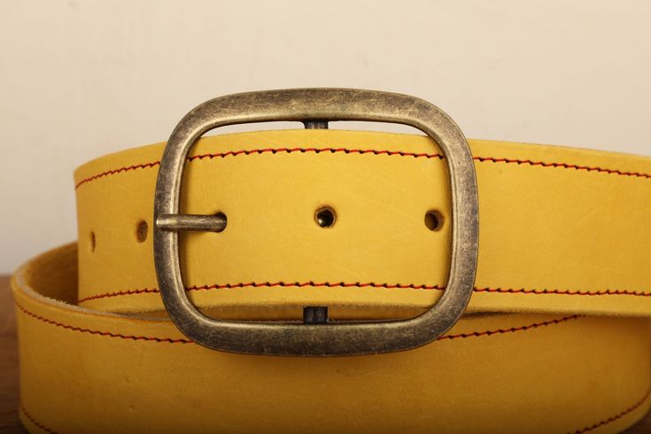 Our 100% Real Leather snap closure belts are handcrafted with lots of love right here in our studio, and the entire process is done by hand, and made to order. We use the finest full grain leather to produce our belts, and each one comes standard with a basic buckle. Please note: This is a handmade product made with natural materials so the color and finish may vary slightly from the image shown.Sizing:Please see our helpful size chart within the images of this listing. If you don't see your siz Adjustable Artisan Leather Belt Buckles, Artisan Leather Belt Buckle With Antique Design, Leather Belts With Antique Buckle For Gift, Leather Belt With Brass Buckle As Gift, Artisan Handmade Leather Belt Buckles, Handmade Artisan Leather Belt Buckles, Handmade Adjustable Leather Belt Buckles, Leather Belt Buckles With Brass Buckle For Everyday, Vintage Leather Belt Buckles As Gift