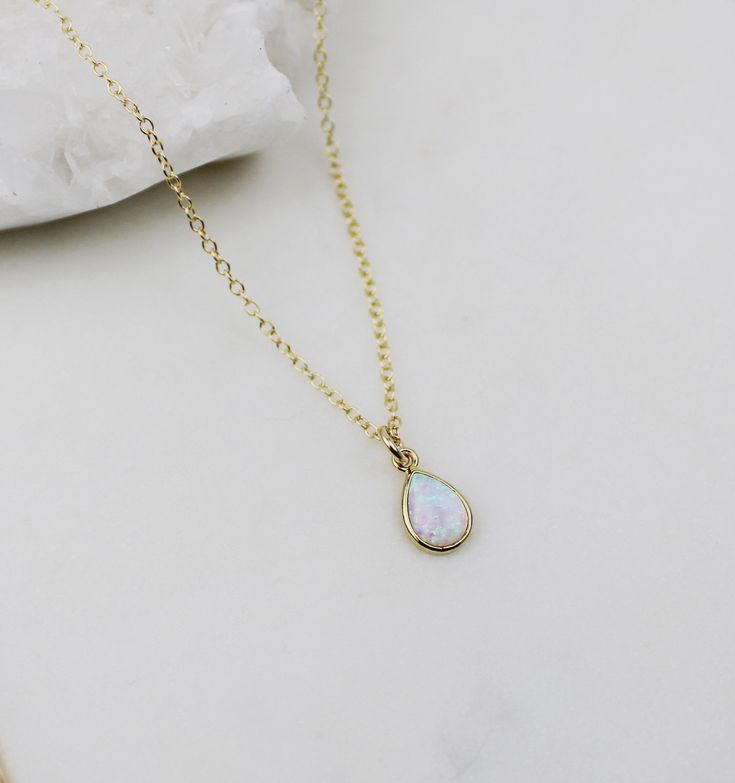 Opal necklace, dainty necklace, bridesmaid gift necklace, gold necklace, dainty necklace, birthday gift for her, birthday gifts, jewelry Gold + Opal Pendant necklace D E T A I L S: *12mm x 8mm Gold plated oval opal pendant *Gold Filled satellite beaded or cable chain *Select your perfect length SHIPPING: *Free domestic shipping on all orders PACKAGING: *All pieces come beautifully packaged, perfect for gift giving. Find more to ❤️ here: http://etsy.com/shop/thejewelrystandard Gold Opal Charm Necklace As Gift, Gold Teardrop Opal Necklace, Opal Jewelry With Delicate Chain As Gift, Delicate Opal Chain Jewelry As Gift, Delicate Opal Chain Jewelry Gift, Delicate Opal Chain Jewelry For Gifts, Teardrop Opal Gemstone Necklaces, Teardrop Gemstone Necklace For Birthday, Delicate Opal Jewelry For Gifts