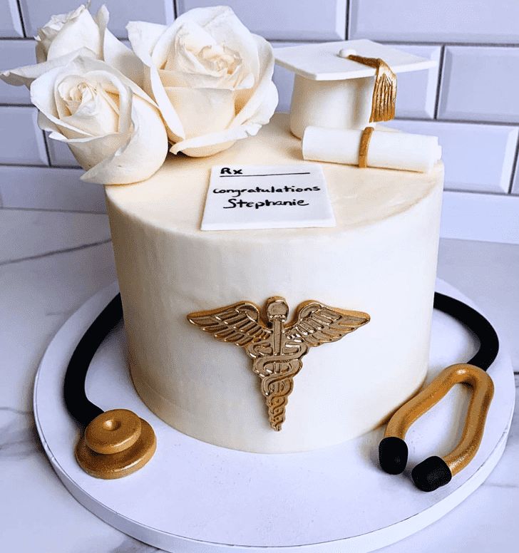 a cake decorated with white roses and medical equipment