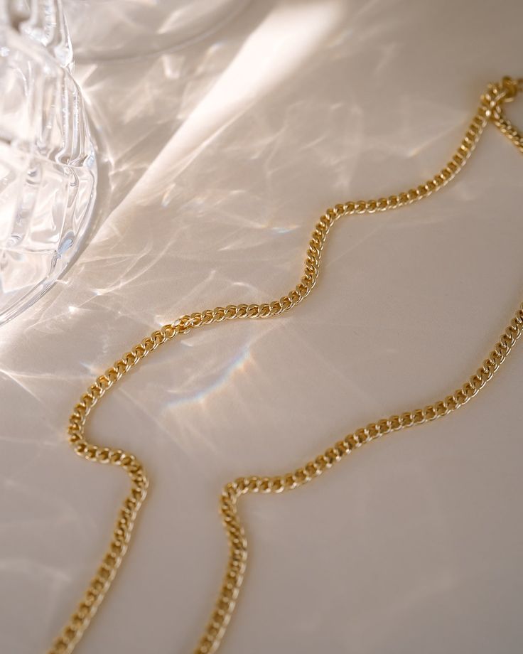 Make a statement with the Tribeca Curb Chain Choker! Perfect for layering and creating unique looks, this choker will provide a subtle but bold look. Express yourself and show off your style with the Tribeca Curb Chain Choker! NECKLACE FEATURES Material: Brass, 16K Gold Filled Chain Dimension: 3X2.2mm Chain Thickness: 0.4mm Chain Style: Curb Chain Lead Free, Nickel Free Size: 16" with 2" chain extender Elegant Gold Snake Chain Choker, Elegant Chunky Cuban Link Chain Bracelet, Elegant Double Chain Cuban Link Necklace, Elegant Necklace With Gold Cuban Link Chain, Classic Gold Chain Choker Necklace, Elegant Cuban Link Necklace With Chunky Chain, Elegant Gold Chain Cuban Link Necklace, Elegant Cuban Link Necklace With Chunky Chain For Gift, Elegant Gold Chain Necklace With Cuban Link