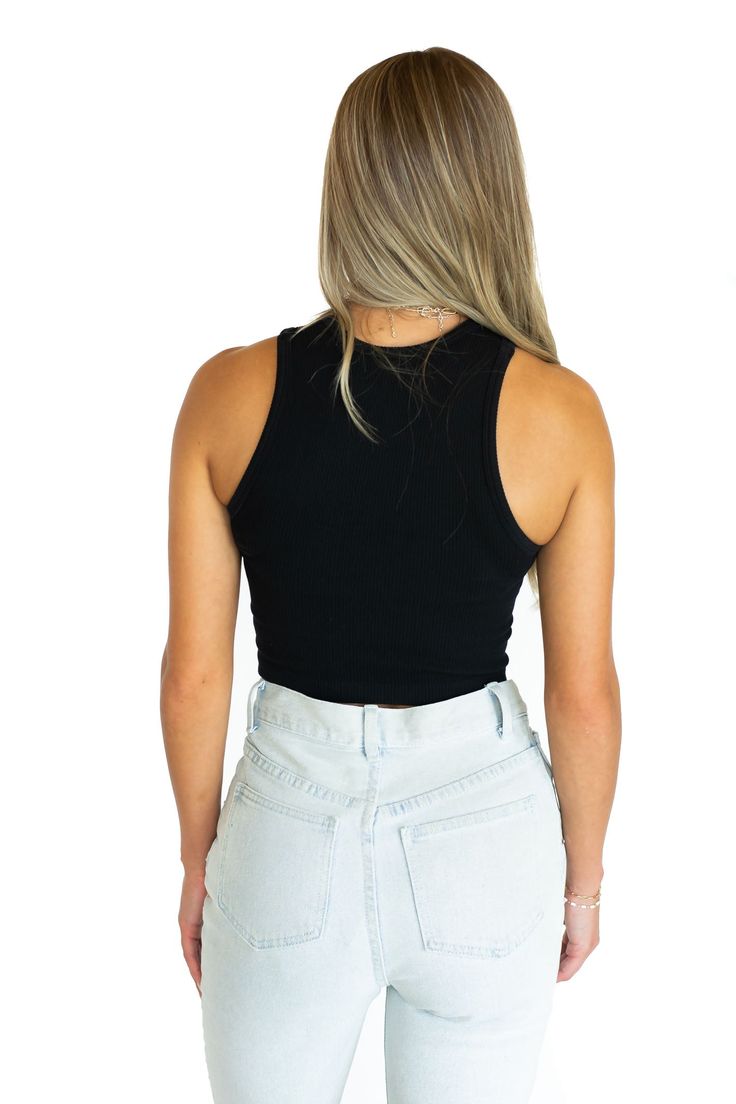 The basic that you need in your closet. The Basic Babe Rib Tank Top is stretchy, fitted, and made of the softest material. It is the perfect top to wear under a shacket or wear alone. Models are 5'3 and wearing a one size fits all Available in 3 Colors - White, Black, & Blue Hand Wash Cold Hang to Dry 92% Nylon & 8% Spandex Casual Fitted Crop Top In Solid Color, Casual Fitted Crop Top, Fitted Solid Color Casual Tank Top, Casual Fitted Solid Color Crop Top, Casual Elastane Crop Top, Casual Seamless Elastane Top, Casual Elastane Tank Crop Top, Fitted Solid Color Tank Crop Top, Stretch Everyday Tops