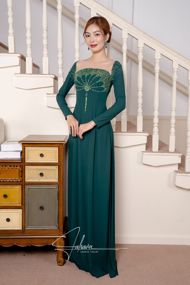 This floor length dress features a beautiful moss green fabric color, adorned with intricate beaded patterns. Its elegant design exudes sophistication and style, making it the perfect choice for any formal occasion. Elevate your wardrobe with this timeless piece. Traditional Dresses With Fitted Bodice For Evening, Green Floor-length Gown For Gala, Green Floor-length Gown For Evening, Green Floor-length Gala Gown, Green Maxi Dress With Fitted Bodice For Gala, Elegant Dark Green Wedding Dress, Green Embellished Dress With Fitted Bodice, Green Floor-length Evening Dress With Fitted Bodice, Elegant Dark Green Gala Dress