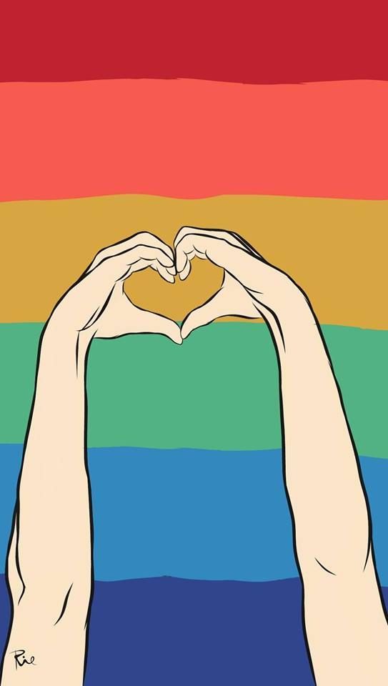 two hands making a heart shape over a rainbow colored background with the word love written on it