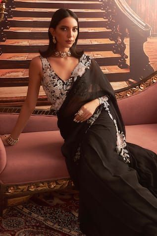 Black pre-draped saree with floral applique motifs on border, embellished by beads, sequins and cut-out borders. Comes with embroidered blouse. - Aza Fashions Pre Draped Saree, Draped Saree, Vacuum Storage, Drape Saree, Ready To Wear Saree, Indian Wedding Wear, Black Saree, Embellished Blouse, Sleeves Blouse