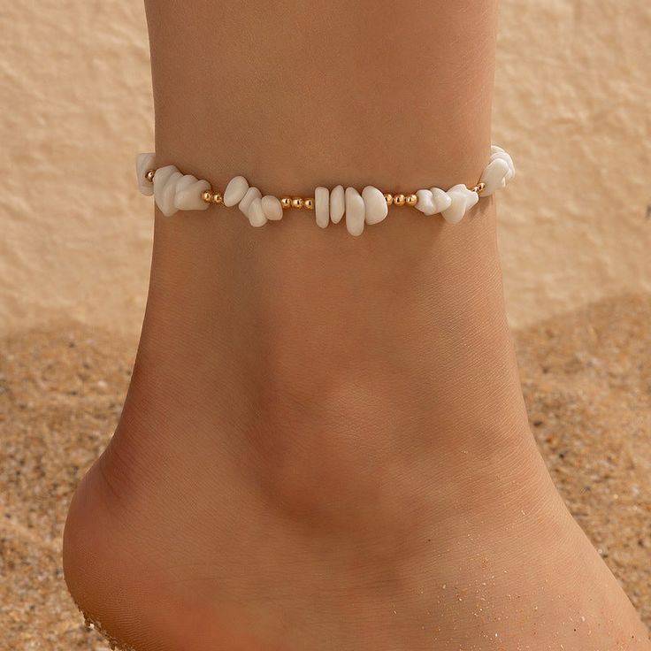 Embrace Your Bohemian Spirit Step into the warm embrace of summer with our Boho Shell Charm and Crushed Stone Anklet Set. Perfectly crafted to enhance your beach attire, this set of anklets brings a touch of bohemian elegance to any outfit. Whether you're strolling along the seashore or dancing under the stars, these anklets add a fashionable flair that celebrates your free-spirited style. Product Features Each anklet in this set is a showcase of thoughtful design and craftsmanship. Made with a tin alloy base, these pieces are adorned with charming geometric patterns and embellished with natural shell pieces and crushed stones, giving each piece a unique, artisanal feel. The anklets measure 20cm in length, ensuring a comfortable fit for all. Material: Durable metal with a tin alloy base St Trendy Handmade Anklets For Spring, Handmade Trendy Anklets For Spring, Bohemian Jewelry For Summer Beach Party, Summer Festival Bracelets, Bohemian Jewelry For Beach Party, Bohemian Beach Party Jewelry, Trendy Adjustable Anklets For Summer, Adjustable White Anklets For Spring, Trendy Summer Strand Jewelry