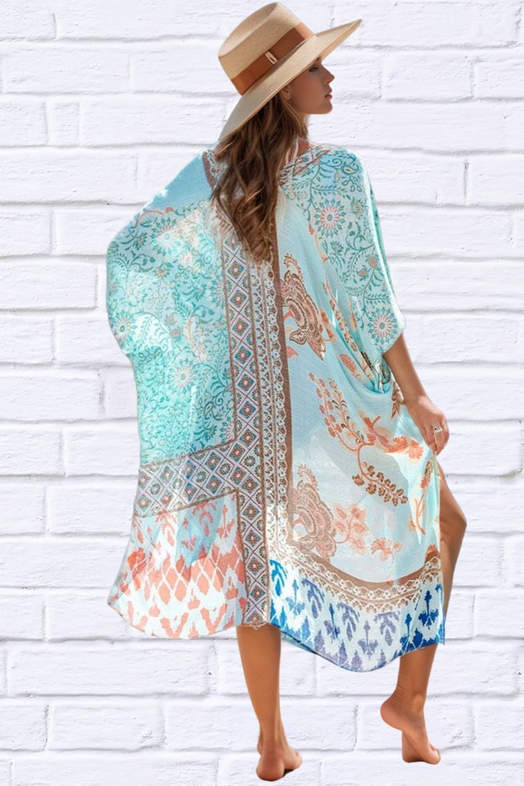 Introducing our Printed Open Front Cover-Up Kimono, a must-have addition to your beachwear collection. Crafted with lightweight fabric and featuring a vibrant printed design, this kimono adds a touch of elegance and flair to any swimwear ensemble. With its open front style, it effortlessly drapes over your shoulders, providing just the right amount of coverage while still allowing your swimsuit to peek through. The loose and flowy fit ensures comfort and breathability on hot summer days. Perfect Floral Print Wrap Beachwear Cover-up, Patterned Kaftan For Summer Beach Cover-up, Floral Print Open Front Cover-up For Vacation, Vacation Beach Cover-up Kimono With Kimono Sleeves, Printed Beach Dress For Spring Cover-up, V-neck Boho Print Kimono For Beach Cover-up, Bohemian Lightweight Cover-up For Beach Party, Summer Patterned Kimono For Beach Cover-up, Boho Print Cover-up With Kimono Sleeves For Beach Season