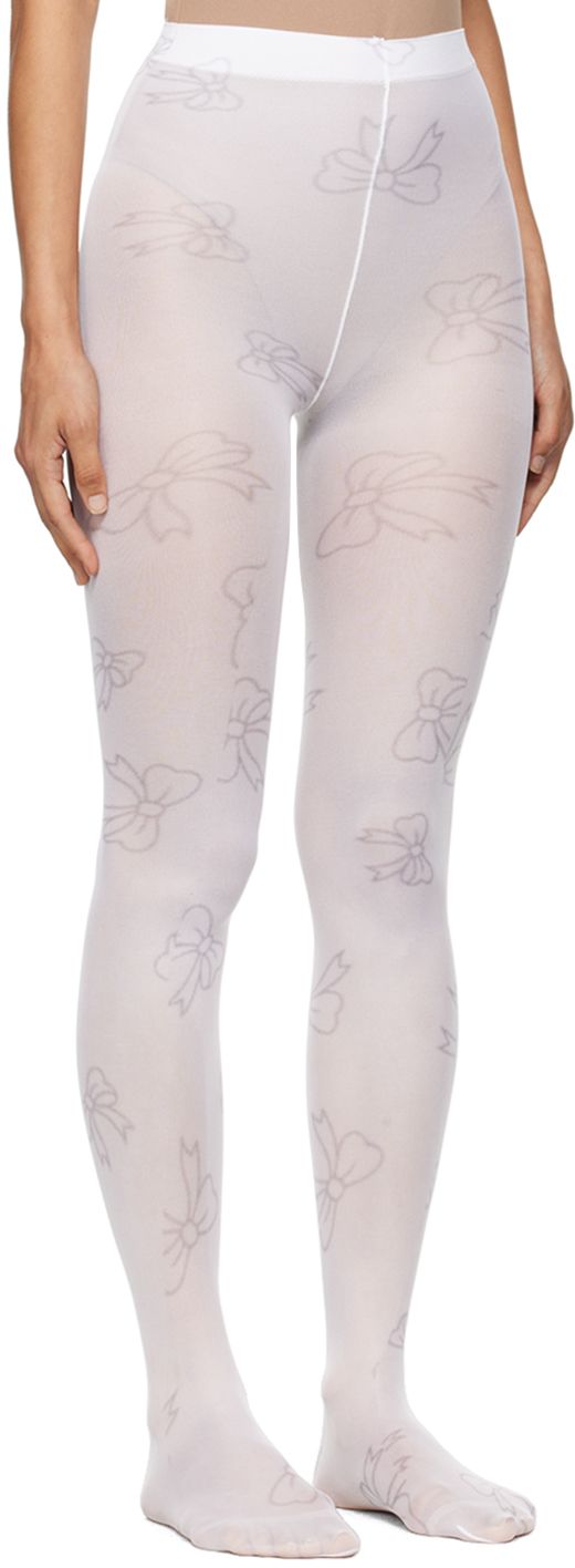 Stretch nylon jersey tights in white. Graphic pattern printed throughout. Supplier color: White White Micro-elastic Tights, White Stretch Tights, Spring White Tight Hosiery, White Tight Spring Hosiery, White Tight Hosiery For Spring, White Spring Hosiery, Fitted White Spring Hosiery, Spring White Stretch Tights, White Stretch Tights For Spring