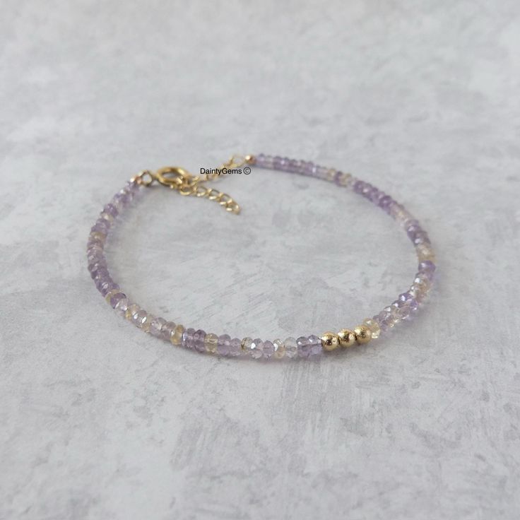 Fall in love with our dainty and sparkly ametrine gemstone beaded bracelet, perfect timeless delicate minimalist design, handmade to be stacked or worn on its own. Will make a thoughtful birthday, Christmas, or anniversary gift for your wife, mother, sister, daughter, or friend. Ametrine is a combination of Citrine and Amethyst and can be a birthstone for both February and November. Your purchase will arrive elegantly packed  in a gift-ready suede storage bag  and will include a complimentary cleaning cloth. Treat yourself or your loved ones with this high-quality handmade jewelry gift.  D E T A I L S -Genuine high-quality faceted ametrine rondel beads -Bead size approx. 3mm, the bracelet appears larger in photos  - sterling silver or 14k gold filled glittery accent beads and components -B Dainty Purple Beaded Bracelets With Round Beads, Dainty Purple Beaded Bracelet With Round Beads, Dainty Purple Beaded Bracelet, Amethyst Gemstone Beads Bracelets As Gift, Lavender Bracelets With Spacer Beads As Gift, Lavender Bracelets With Spacer Beads For Gift, Gold Beaded Amethyst Bracelets, Dainty Handmade Beaded Bracelets For Anniversary, Lavender Beaded Bracelets With Natural Stones