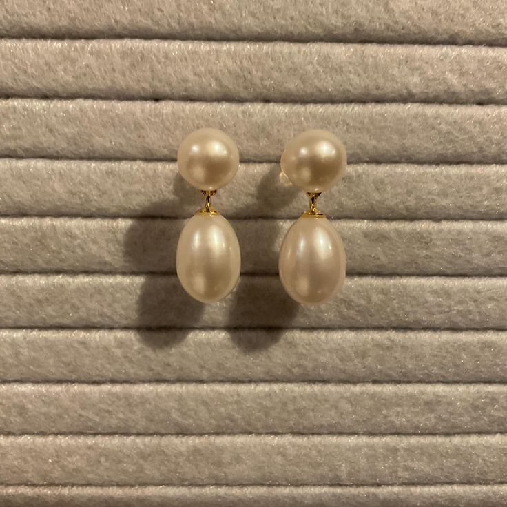 Dainty white pearl earrings.  1 inch length.  Materials:  Pearl Beautiful 8mm round pearls and 12mm teardrop freshwater pearls have a lovely shine.  These are dainty 1 inch pearl earrings.  These are minimalist earrings and are perfect for wedding and bridal and special occasions.  Pearls are always the perfect romantic gift! Packaged in a complimentary silk brocade jewelry pouch. Free Shipping - Pearlcore Trending Jewelry Elegant Long Drop Hypoallergenic Pearl Earrings, Elegant Hypoallergenic Long Drop Pearl Earrings, Delicate Pearl Earrings With Pearl Pendant, Delicate Pearl Earrings With Pendant, Elegant Akoya Pearl Earrings With Pearl Charm, Timeless White Pear-shaped Earrings, Elegant Pearl Earrings With Pearl Pendant, Elegant Pearl Earrings With Pendant, Long Drop Pearl Earrings With Pearl Pendant